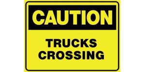 CAUTION TRUCKS CROSSING